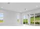 Light-filled living room with sliding glass doors and backyard access at 197 Valencia Ridge Dr, Auburndale, FL 33823