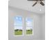 Bedroom with two windows and a view of the landscape at 197 Valencia Ridge Dr, Auburndale, FL 33823