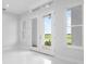 Bright entryway with double doors opening to a view and tile flooring at 197 Valencia Ridge Dr, Auburndale, FL 33823