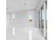Bright living room featuring tile floors and sliding glass doors at 197 Valencia Ridge Dr, Auburndale, FL 33823