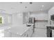 Modern kitchen with white cabinets, stainless steel appliances, and an island at 197 Valencia Ridge Dr, Auburndale, FL 33823