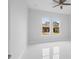 Bedroom with large windows overlooking the neighborhood at 197 Valencia Ridge Dr, Auburndale, FL 33823