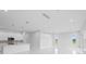 Modern kitchen with white cabinets, stainless steel appliances, and an island at 197 Valencia Ridge Dr, Auburndale, FL 33823