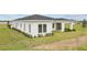 Side exterior view of house with landscaping at 197 Valencia Ridge Dr, Auburndale, FL 33823