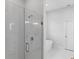 Bathroom with a glass shower, soaking tub, and marble tile at 197 Valencia Ridge Dr, Auburndale, FL 33823