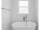 Bathroom with a freestanding bathtub and a window at 197 Valencia Ridge Dr, Auburndale, FL 33823