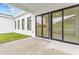 Covered patio with sliding glass doors leading to backyard at 197 Valencia Ridge Dr, Auburndale, FL 33823