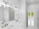 Modern bathroom with double vanity and a view from the shower at 197 Valencia Ridge Dr, Auburndale, FL 33823