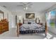 Main bedroom with king-size bed and wood furniture at 1002 Russel Ridge Ct, Kissimmee, FL 34747