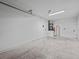 Unfinished garage with water heater and ample space at 2977 Kokomo Loop, Haines City, FL 33844