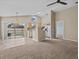 Kitchen with light wood cabinets, stainless steel appliances, and a breakfast bar at 2977 Kokomo Loop, Haines City, FL 33844