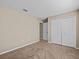 Bedroom with double door closet and access to bathroom at 2977 Kokomo Loop, Haines City, FL 33844