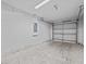 Clean and spacious garage with an open garage door at 2977 Kokomo Loop, Haines City, FL 33844
