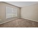 Well-lit bedroom with neutral carpeting at 2977 Kokomo Loop, Haines City, FL 33844