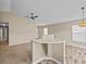 Living room with a breakfast bar and laminate wood flooring at 2977 Kokomo Loop, Haines City, FL 33844