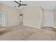 Spacious living room with carpeted floors and neutral walls at 2977 Kokomo Loop, Haines City, FL 33844