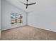 Spacious bedroom with carpeting and a ceiling fan at 2977 Kokomo Loop, Haines City, FL 33844