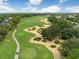 Aerial view of golf course with cart path at 2977 Kokomo Loop, Haines City, FL 33844