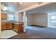 Kitchen features wood cabinets, stainless steel appliances, and a breakfast bar at 3043 Antique Oaks Cir # 171, Winter Park, FL 32792