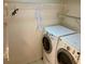 Convenient laundry room with washer, dryer, and shelving at 3043 Antique Oaks Cir # 171, Winter Park, FL 32792