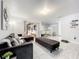 Spacious living room, L-shaped sectional sofa, view into the kitchen at 2405 Boy Scout Rd, Apopka, FL 32703