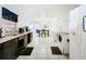 Kitchen with dark cabinets, white appliances, and tile floor at 2405 Boy Scout Rd, Apopka, FL 32703