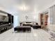 Bright living room with L-shaped sectional sofa and tile floors at 2405 Boy Scout Rd, Apopka, FL 32703