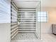 Modern shower with glass enclosure and gray and white striped tile at 2405 Boy Scout Rd, Apopka, FL 32703