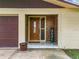 Inviting front entry with wood-paneled accent wall and tiled flooring at 2405 Boy Scout Rd, Apopka, FL 32703