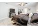 Main bedroom with large bed, electric fireplace, and TV at 2405 Boy Scout Rd, Apopka, FL 32703