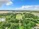 Aerial view of property showing large lot and distant development at 2405 Boy Scout Rd, Apopka, FL 32703