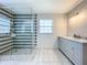 Bathroom with double vanity and a large glass shower with striped tile at 2405 Boy Scout Rd, Apopka, FL 32703