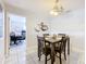 Dining room with dark wood table and chairs, view into office at 2405 Boy Scout Rd, Apopka, FL 32703