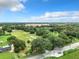 Aerial view of a large lot with road access and surrounding trees at 2405 Boy Scout Rd, Apopka, FL 32703
