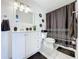Bathroom with white vanity, black and white decor, and shower/tub combo at 2405 Boy Scout Rd, Apopka, FL 32703