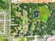 Aerial lot view showing neighboring houses and a pond at 2405 Boy Scout Rd, Apopka, FL 32703