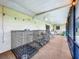 Screened porch with dog kennels and outdoor furniture at 2405 Boy Scout Rd, Apopka, FL 32703