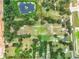 Aerial view of large lot with several homes and a pond at 2405 Boy Scout Rd, Apopka, FL 32703
