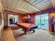 Game room with pool table and wood-paneled walls at 2405 Boy Scout Rd, Apopka, FL 32703