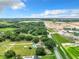Aerial view of home with pool and large lot, near construction at 2405 Boy Scout Rd, Apopka, FL 32703