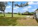 Large backyard with patio and scenic lake view at 2921 Omaha Dr, Deltona, FL 32738