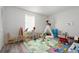 playroom with teepee, toys, and colorful alphabet mat at 2921 Omaha Dr, Deltona, FL 32738