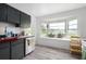 Kitchen with a built-in window seat and gray cabinets at 2921 Omaha Dr, Deltona, FL 32738