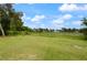 Peaceful backyard scene overlooking a tranquil lake at 2921 Omaha Dr, Deltona, FL 32738