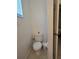 Small half bathroom with toilet and sink at 14102 Indian Creek Dr, Kissimmee, FL 34759