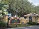 Lake Marion Resort entrance with lush landscaping and a welcoming sign at 14102 Indian Creek Dr, Kissimmee, FL 34759
