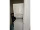 Compact laundry room with stacked washer and dryer at 14102 Indian Creek Dr, Kissimmee, FL 34759