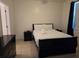 Bedroom with a queen-size bed, nightstands, and dresser at 14102 Indian Creek Dr, Kissimmee, FL 34759