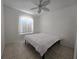 Spacious bedroom with a queen-size bed and ceiling fan at 14102 Indian Creek Dr, Kissimmee, FL 34759
