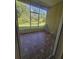 Private screened patio with tiled floor and outdoor seating at 14102 Indian Creek Dr, Kissimmee, FL 34759